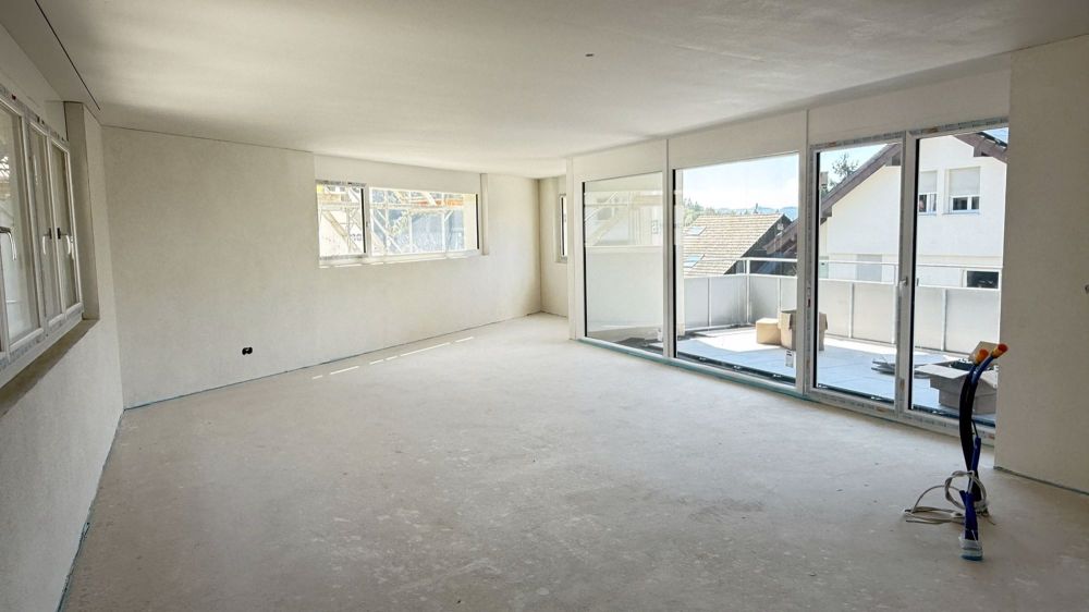 Erstvermietung Moderne 2,5-Zimmerwohnung mit grossem Sitzplatz - Haus A