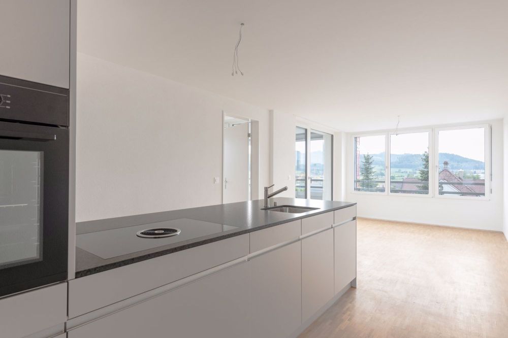 Moderne 3.5-Zimmer-Wohnung mit Balkon und Stadtblick in Zollikofen - Bild 1