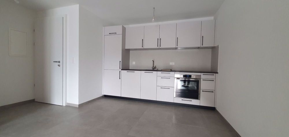NEUF - 2.5 pièces au 1er étage avec parking intérieur - Bild 1