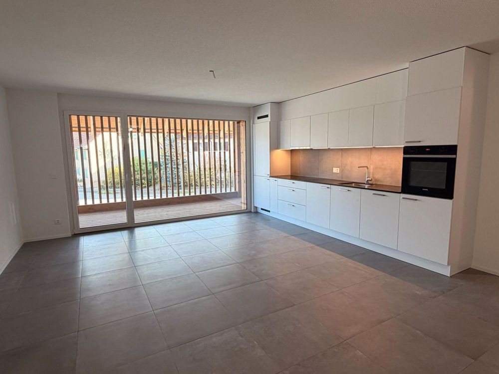 Schönes neues 3.5-Zimmer-Apartment mit großem Wohnzimmer in Coeuve - Bild 1