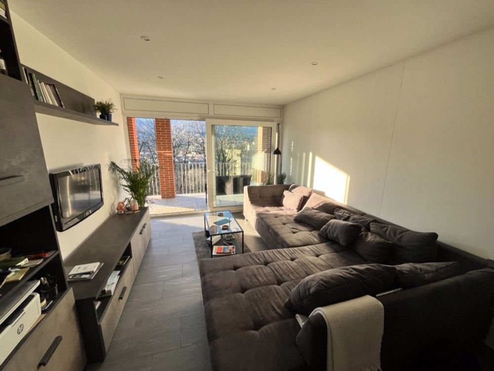 Moderno appartamento 2.5 locali con balcone a Pazzallo - Bild 1
