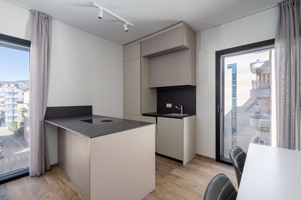 Vivi il nuovo! Elegante Appartamento nel Cuore di Lugano - Bild 11