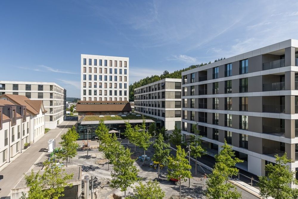 Moderne Wohnung mit grosser Terrasse - KWC-Gasse_Baumalle_mit_Haus_5_rechts.jpg