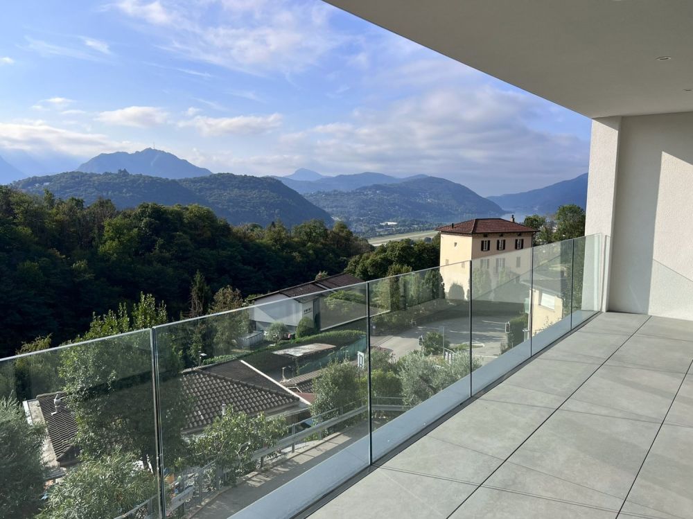 Bellissimo 2,5 locali a Bosco Luganese – prima locazione, soleggiato con parziale vista lago - Bild 1