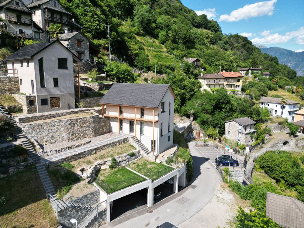 Casa unifamiliare con terreno e posti auto coperti - Bild 5