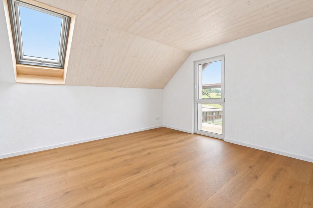 attraktive und grosszügige 3.5-Zimmer Neubauwohnungen zu vermieten - Dachgeschoss - Zimmer KI generiert