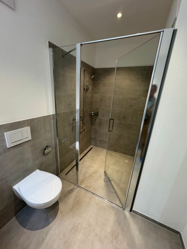 Erstvermietung: hochwertige 3.5-Zimmer-Attikawohnung mit Schloss- & Bergsicht - Bild 6