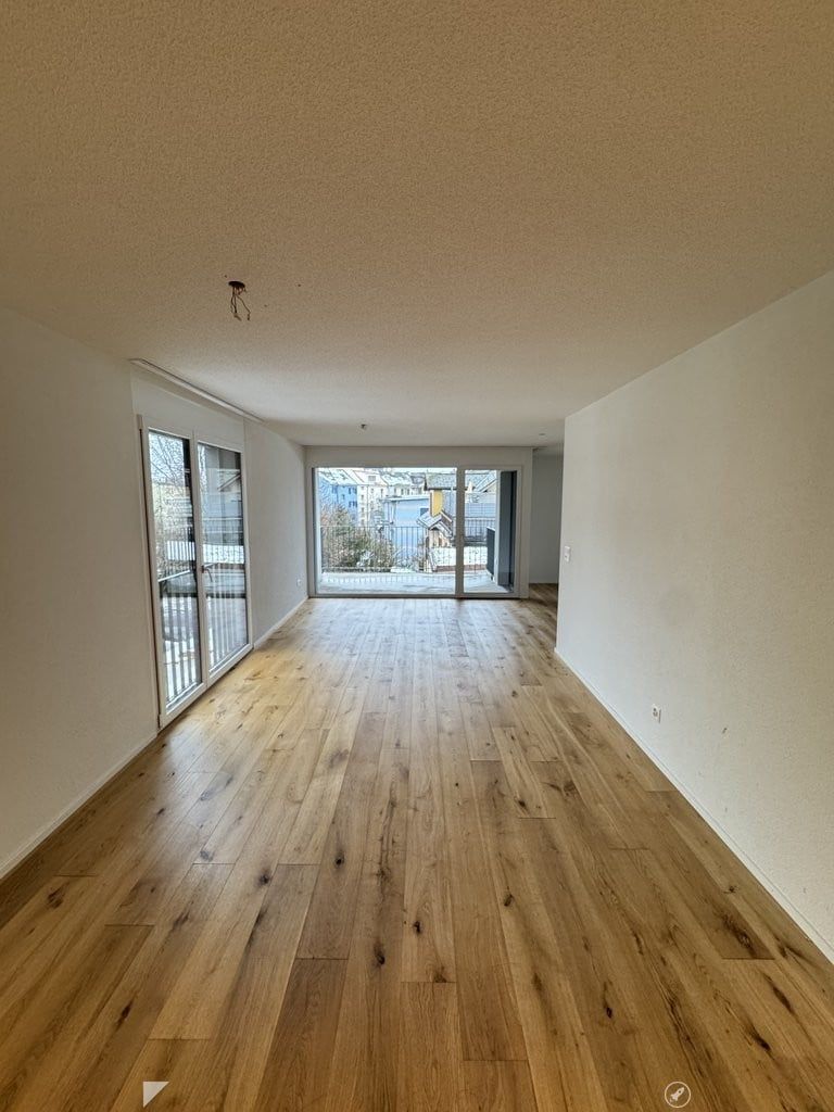 Exklusive 4.5-Zimmer-Neubauwohnung im 2. Obergeschoss ca. 111.6 m2 BGF - Wohnzimmer_1.0.jpg