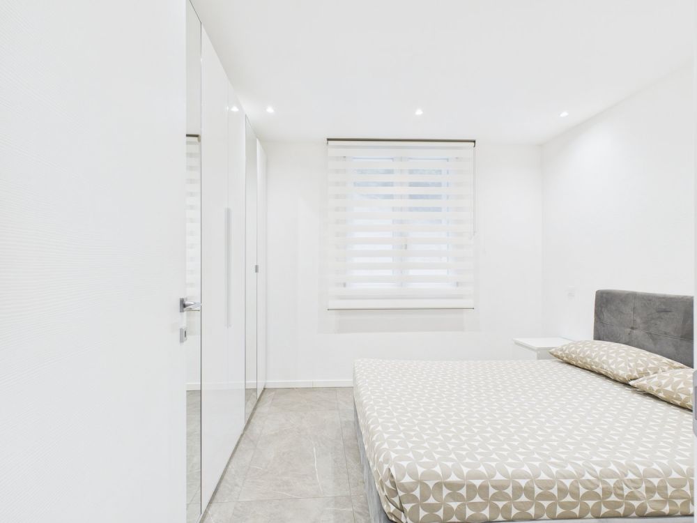 NUOVA COSTRUZIONE:APPARTAMENTO DI 3,5 LOCALI CON GIARDINO E POSTO AUTO - Bild 9