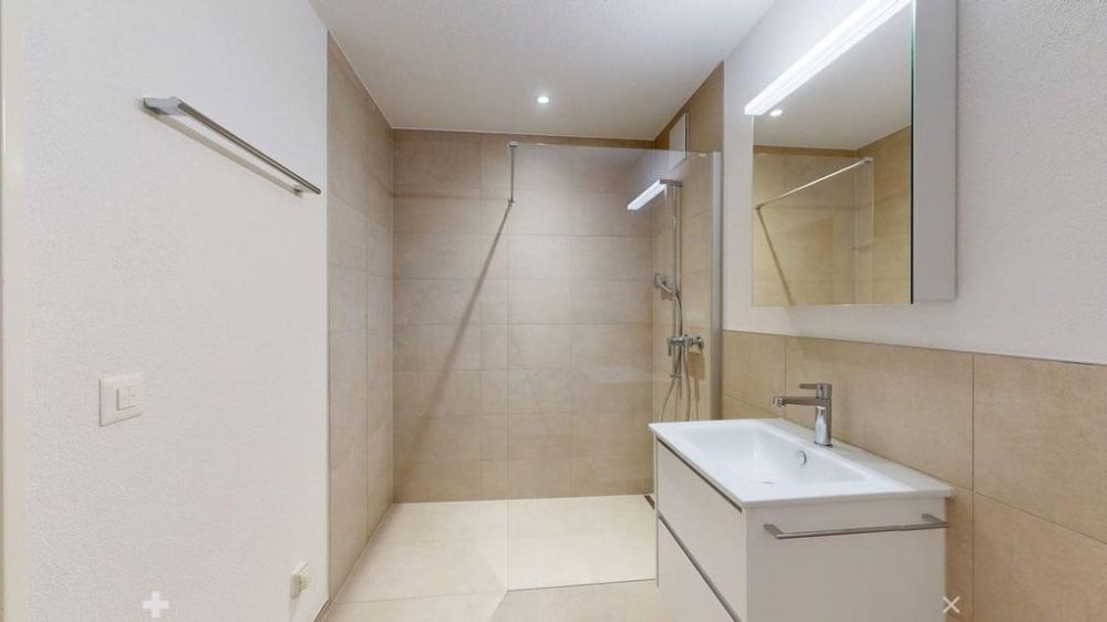 Modernes Wohnen im Neubau: 1.5-Zimmer-Wohnung mit Balkon im 3. OG - WC.jpg