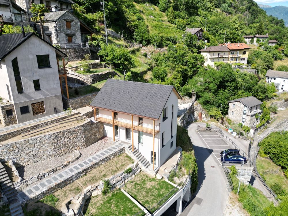 Casa unifamiliare con terreno e posti auto coperti - Bild 10