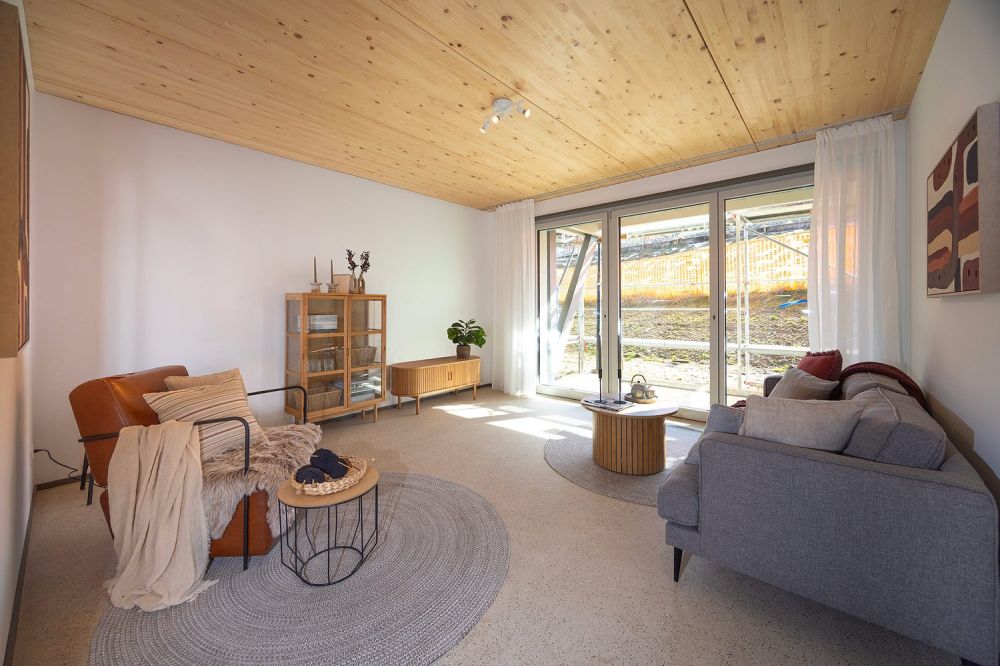 ERSTVERMIETUNG - Alterswohnungen im Büel-Quartier Gossau - Wohnzimmer mit Ausgang zum Sitzplatz