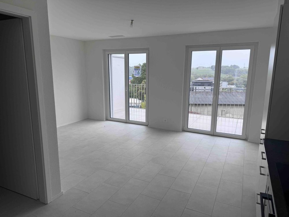 À louer Appartement neuf de 2,5 pièces avec balcon / parking intérieur - Bild 5