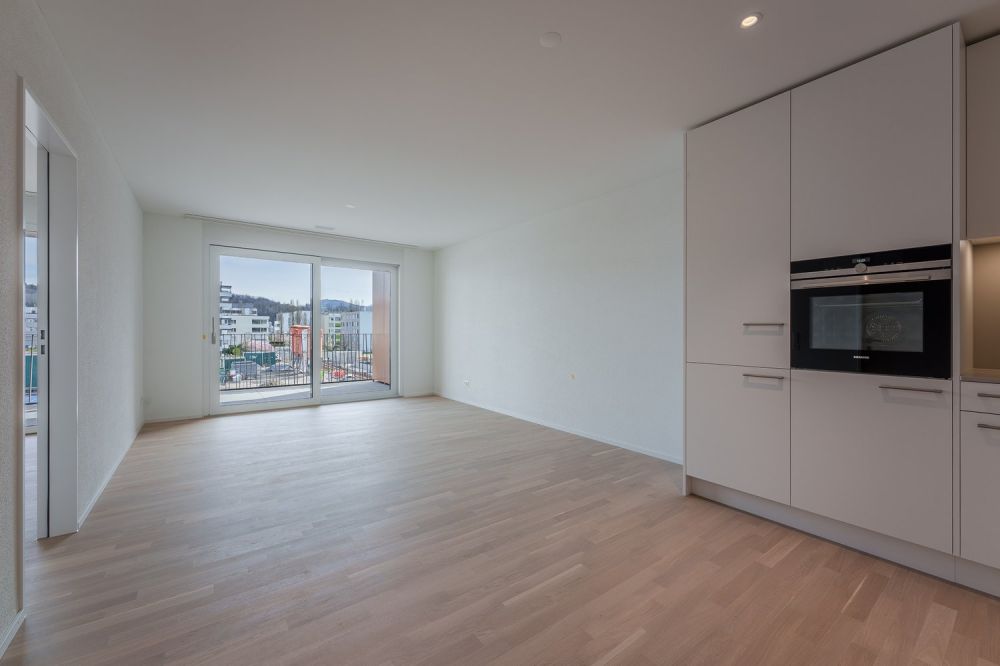Moderne 2.5-Zimmer-Neubauwohnung im Römerpark - Wohnzimmer