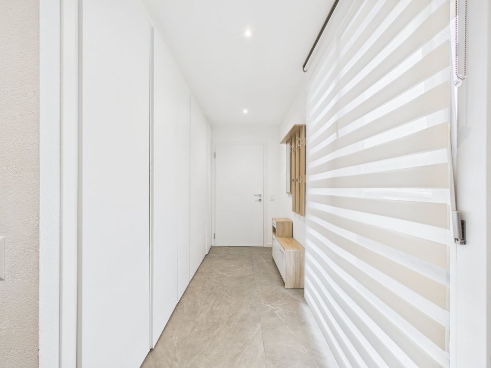 NUOVA COSTRUZIONE:APPARTAMENTO DI 3,5 LOCALI CON GIARDINO E POSTO AUTO - Bild 5