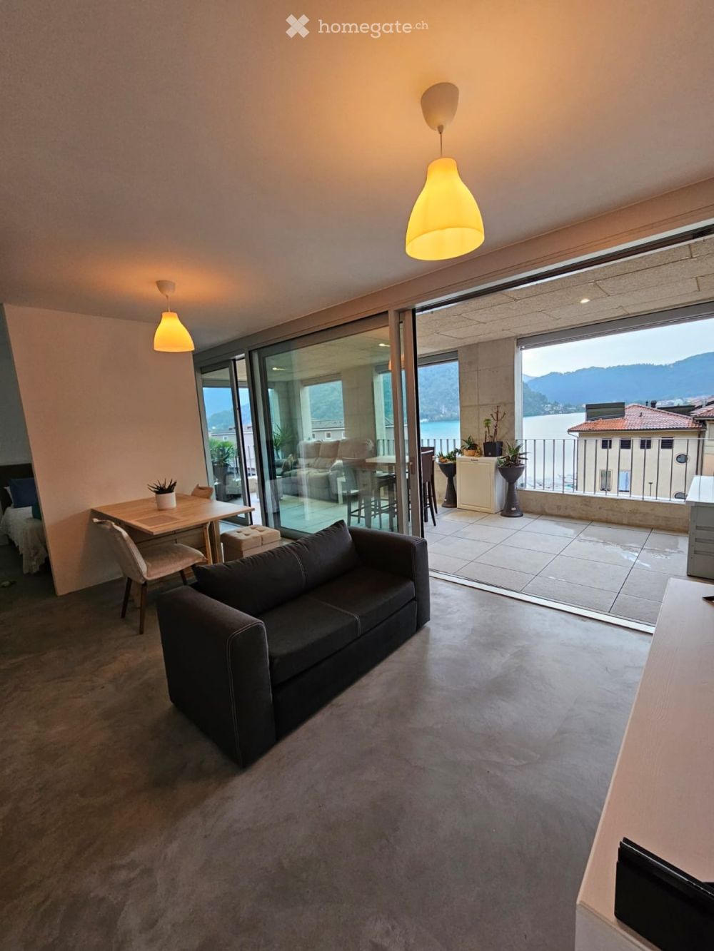 Attico 2,5 locali di nuova costruzione vista lago - Bild 1