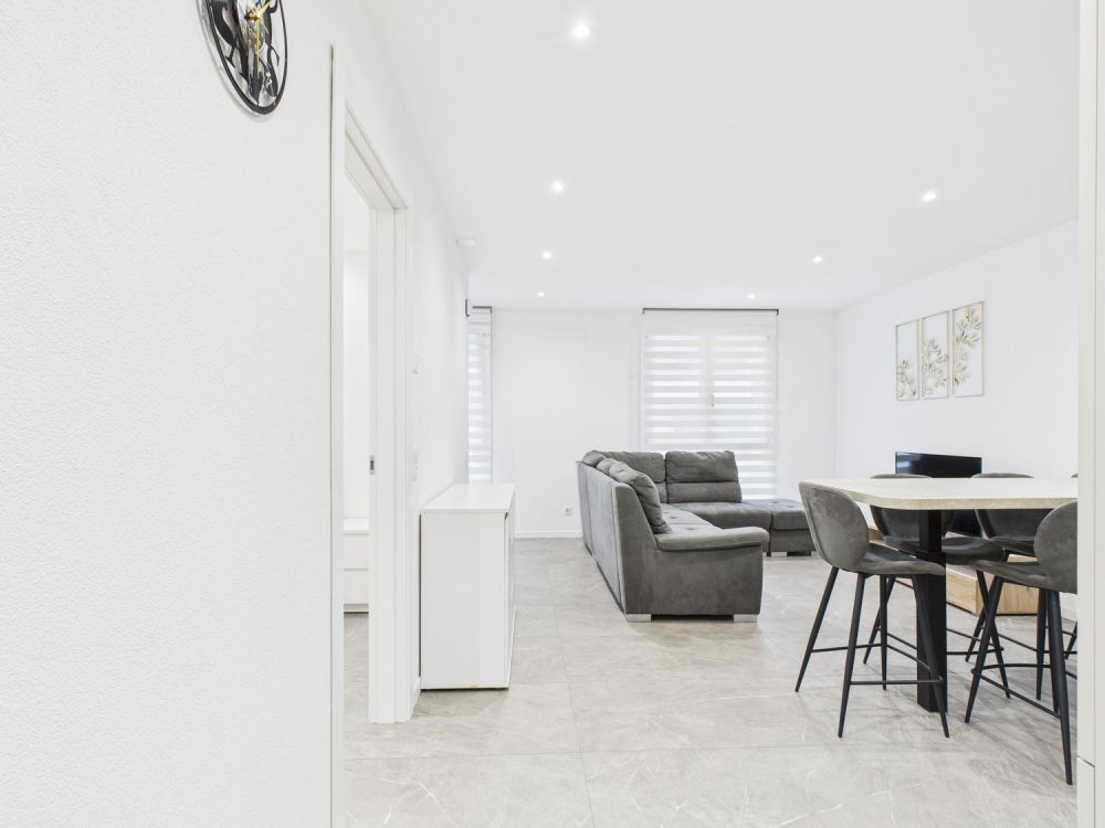 Nuova costruzione : Appartamento di 3,5 locali con giardino e posto auto - Bild 6