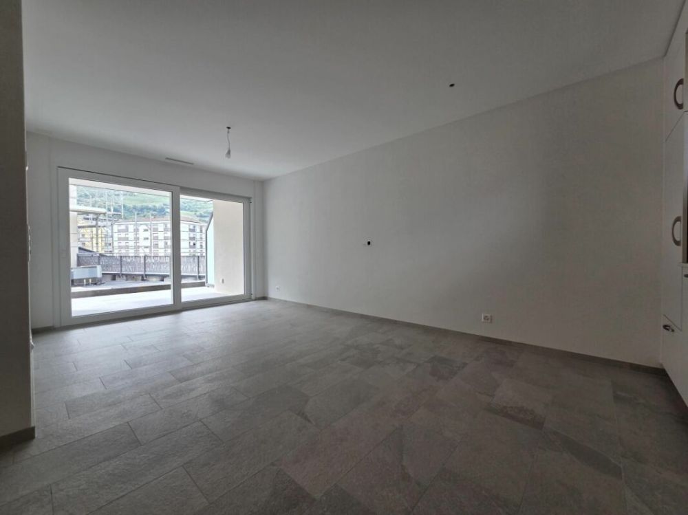 Neuf - Appartement de 2.5 pièces avec balcon et place de parc - Bild 2