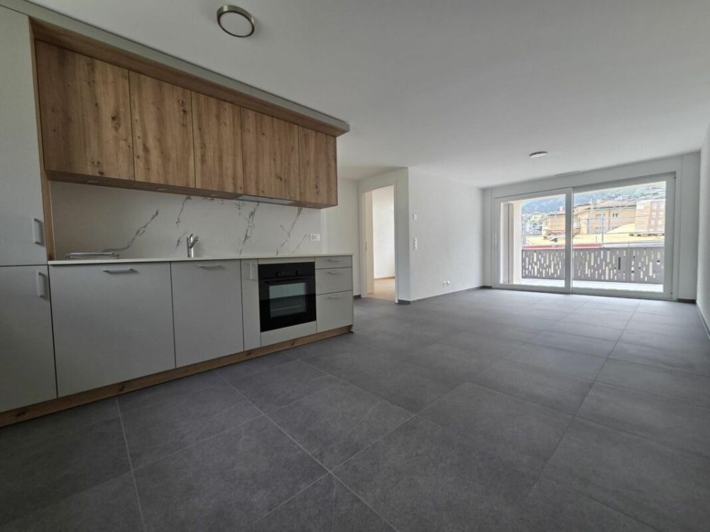 Neuf - Appartement de 3.5 pièces avec balcon et places de parc - Bild 1