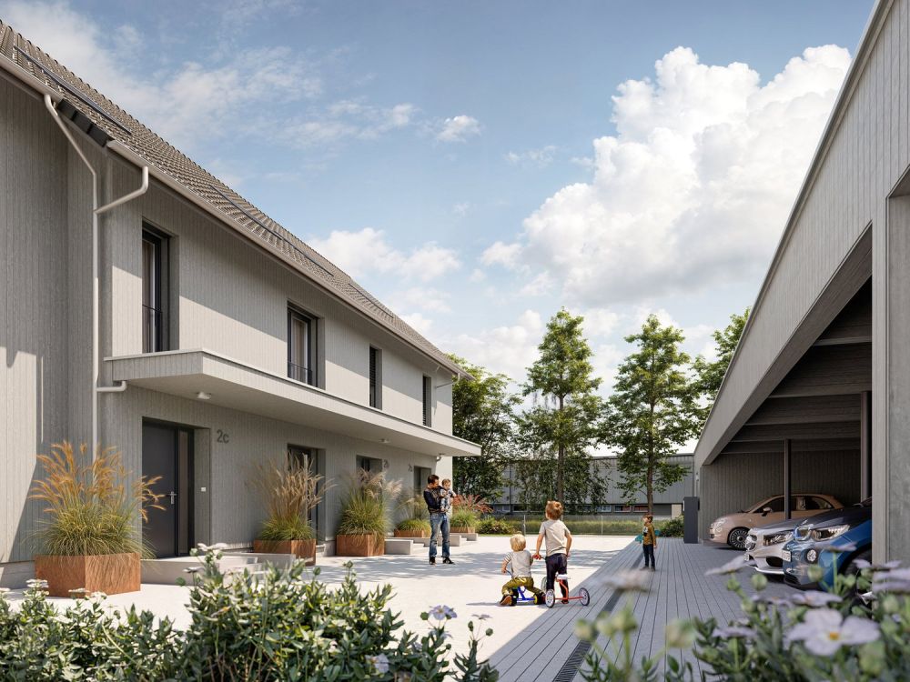 Ein neues Zuhause für Ihre Familie - Der gemeinsam genutzte Hausvorplatz bietet Platz für Spiel und Begegnung