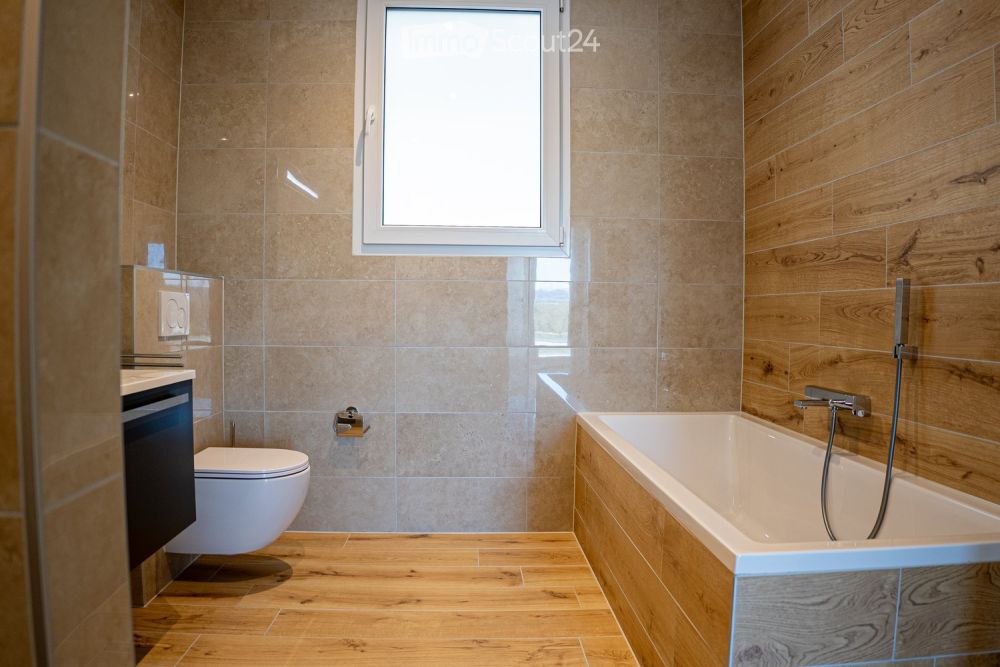 Exklusiv 5,5 Zimmer-Wohnung in Villa mit Blick auf den See und die Berge - Bild 10