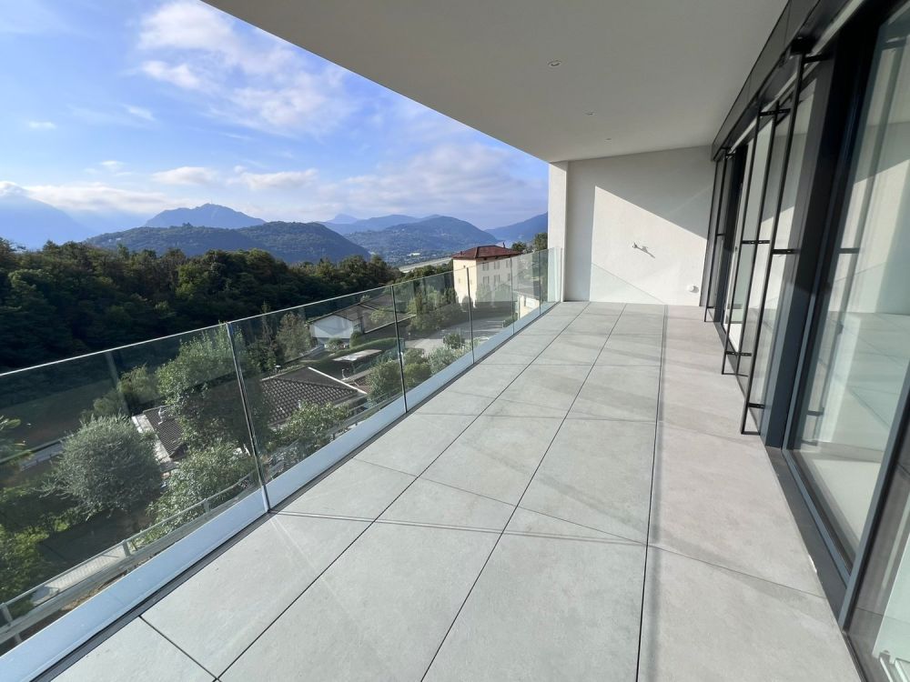 Bellissimo 2,5 locali a Bosco Luganese – prima locazione, soleggiato con parziale vista lago - Bild 2