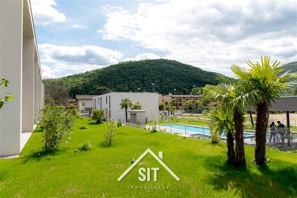 Caslano: Casa a schiera 2.5 locali - Giardino