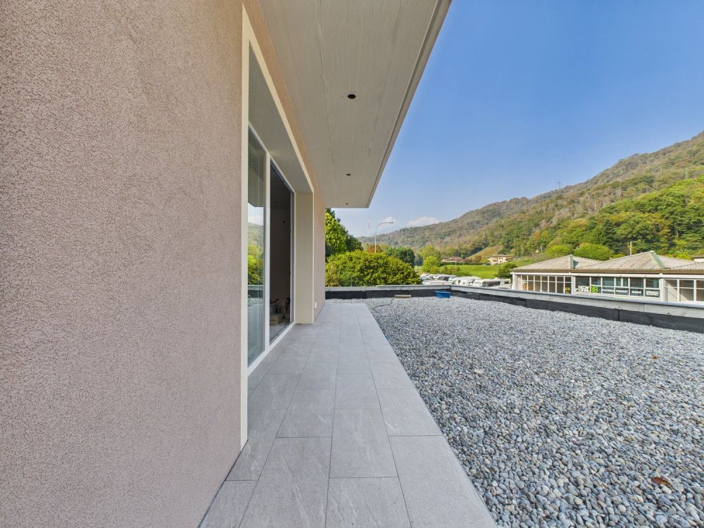 Moderno appartamento 2.5 locali con giardino e vista panoramica a Rivera - Bild 3