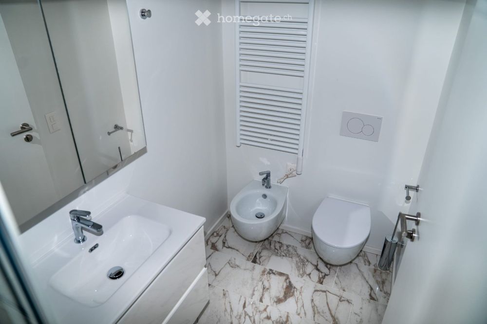 Moderno appartamento 4.5 locali con vista panoramica a Lugano - Bild 9