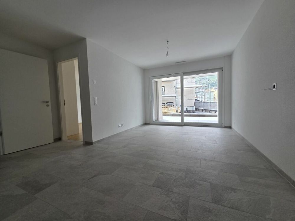 Neuf - Appartement de 2.5 pièces avec balcon et place de parc - Bild 3