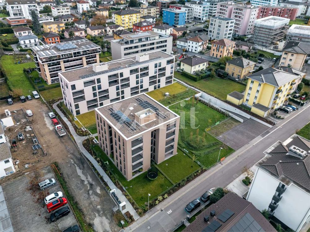 Nuovo appartamento 3.5 locali con giardino - Bild 1