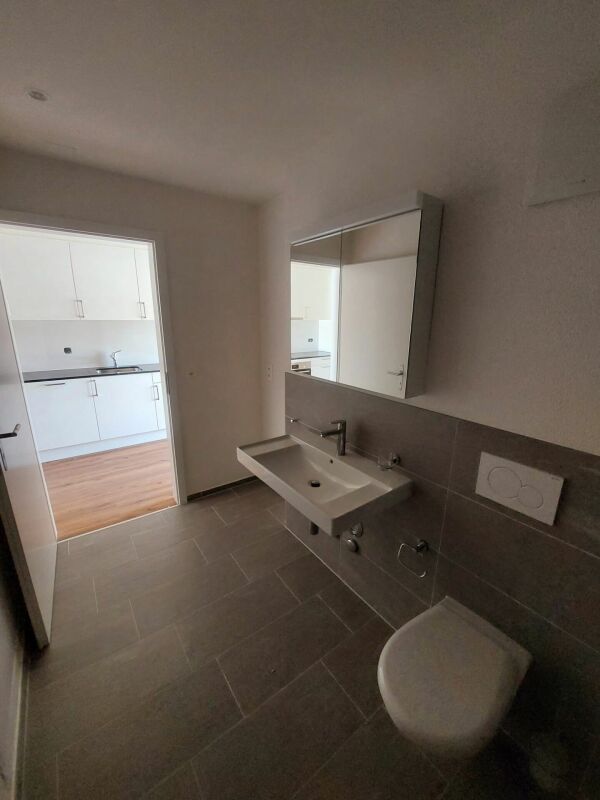 Moderne 1.5-Zimmer-Neubauwohnung mit grosszügigem Balkon - Erstbezug - Bild 9