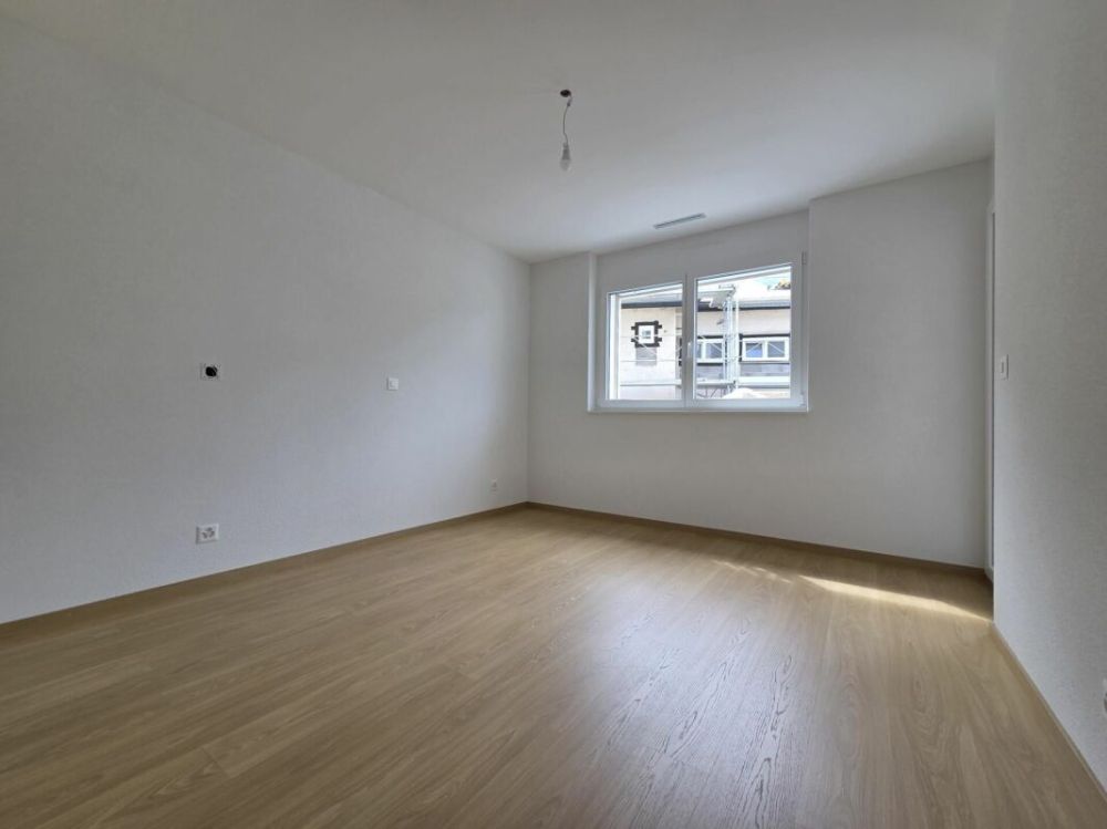 Neuf - Appartement de 2.5 pièces avec balcon et place de parc - Bild 5