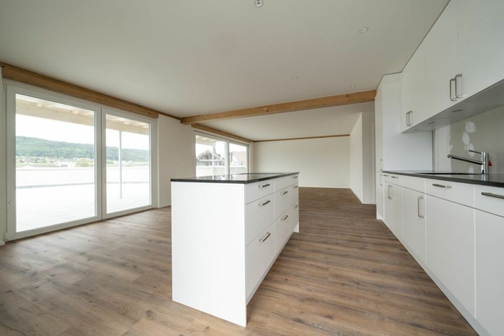 Exklusive 4.5-Zimmer-Attikawohnung mit ca. 163 m² Sonnenterrasse - Erstbezug im Neubau - Bild 7