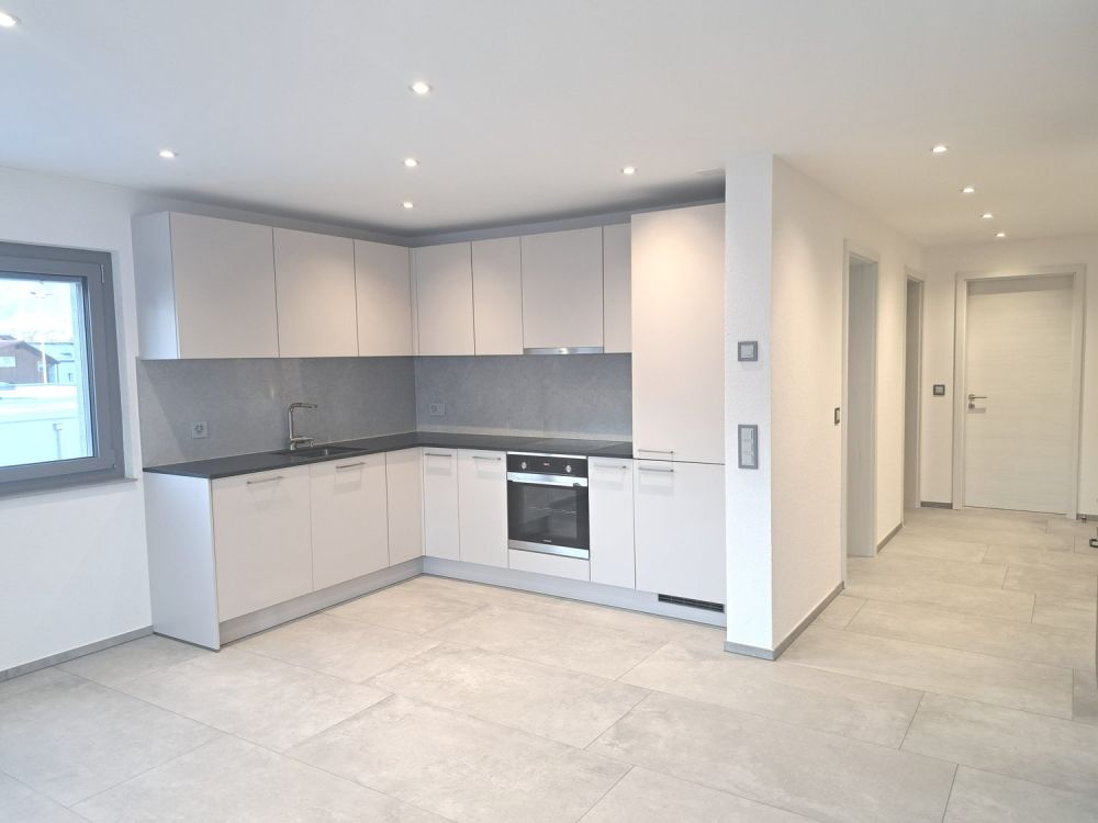 A louer magnifique appartement de 2,5 pièces dans un immeuble neuf avec place de parc dans le garage - Bild 1