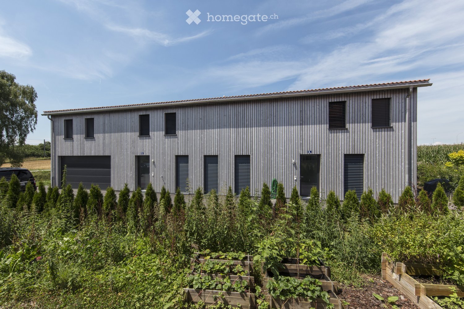 Moderne 5.5-Zimmer-Doppelhaushälfte in ruhiger Lage von Nänikon - Bild 1