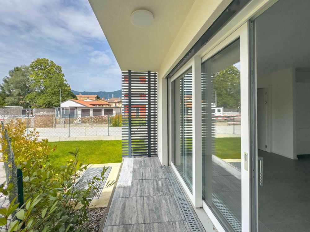 Nuovo e moderno 2.5 locali con giardino - Bild 1