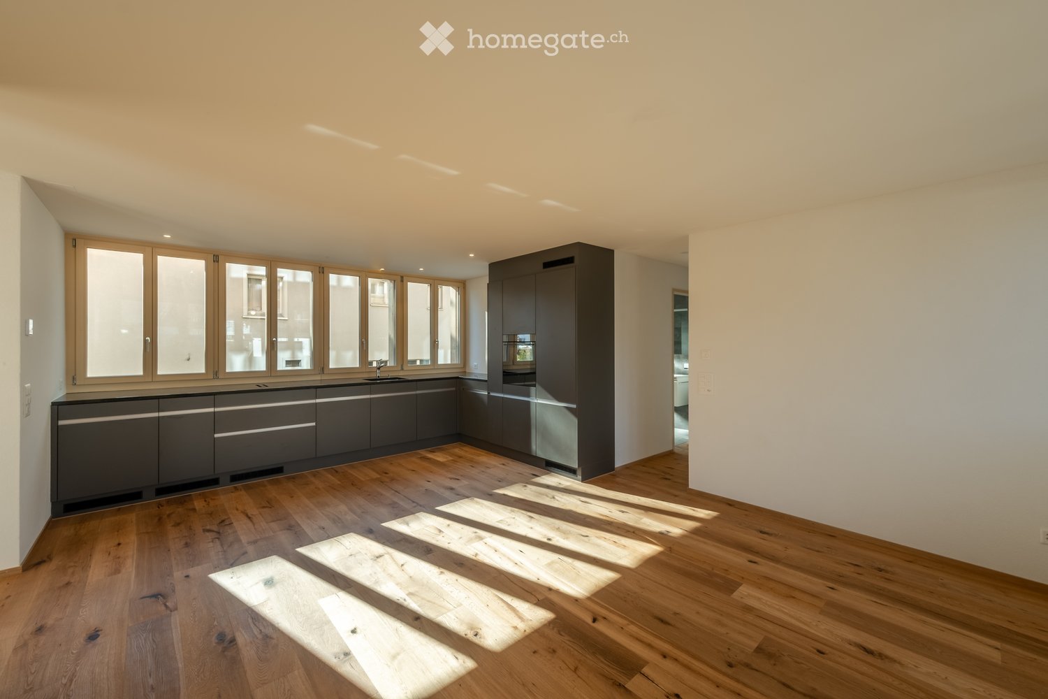 Moderne 3.5-Zimmer-Neubau-Wohnung mit Bergblick in Weite - Bild 1