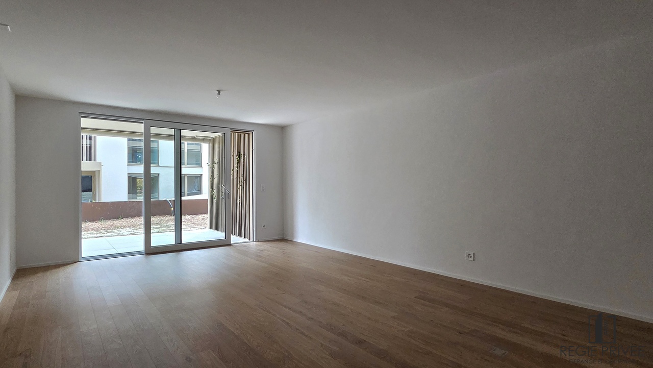 2.5 pièces neuf de standing avec jardin - Séjour