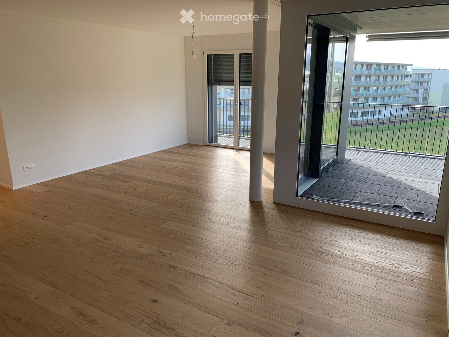 Neubau-Erstbezug in Buchs ZH: 2.5 Zimmer im Grünen & absolut zentral - Bild 4