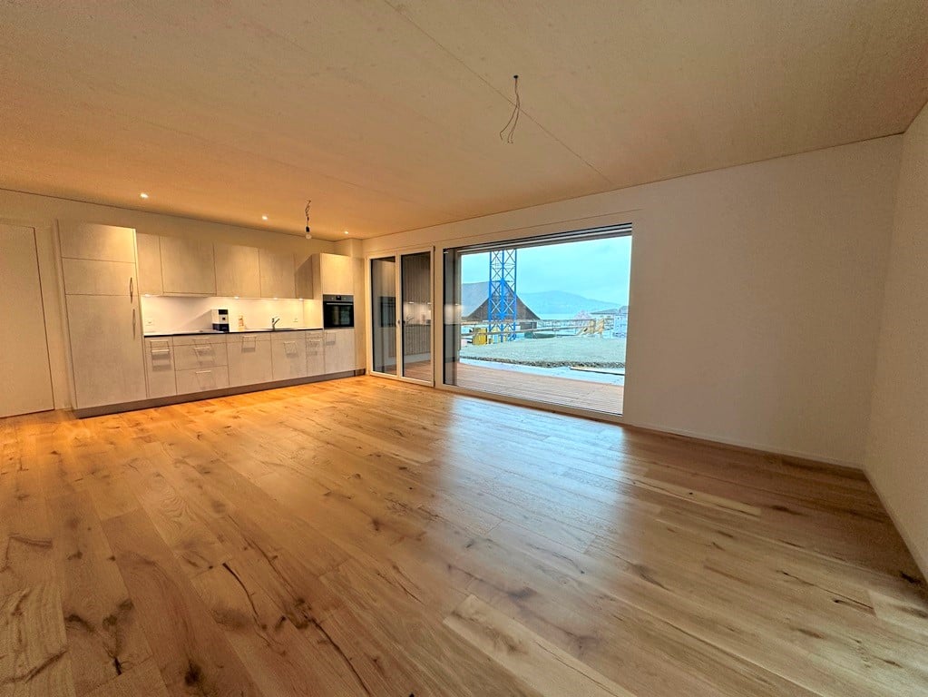 Moderne 2.5 Zimmerwohnung in Aesch zu vermieten! - Küche mit offenem Wohnzimmer