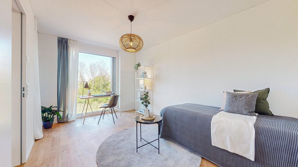 Wohnen auf dem alten Läckerlihuus-Areal - 3.5-Zi-Whg-Muenchenstein-Zimmer-1.jpg